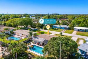 an overhead view of a house with a swimming pool at 721 Java Rd in Cocoa Beach