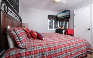 a bedroom with a bed with red pillows at Majestic Getaway 1427 in Gatlinburg +37 photos
