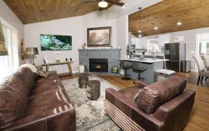 a living room with a couch and a fireplace at Ogle Haven in Gatlinburg