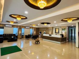 a lobby of a hotel with a reception desk at Hotel Lotus Grand Jubilee in Hyderabad