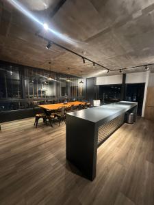 a conference room with a long table and a dining table at Hermoso Estudio in Concepción