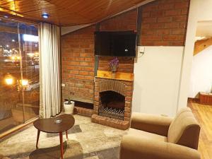 TV a/nebo společenská místnost v ubytování Sumaq Sisa Home & Loft