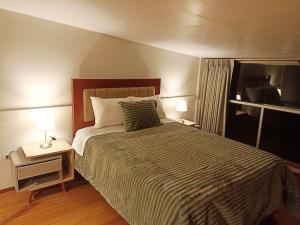 Postel nebo postele na pokoji v ubytování Sumaq Sisa Home & Loft