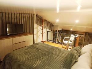 Postel nebo postele na pokoji v ubytování Sumaq Sisa Home & Loft