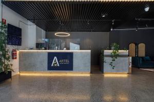 a room with a counter with a sign on it at Artel Apartments Brunswick in Melbourne