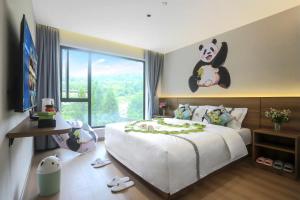 Letto o letti in una camera di Wolong Tongfu Tingtao B&B, China Great Beauty Bear Store