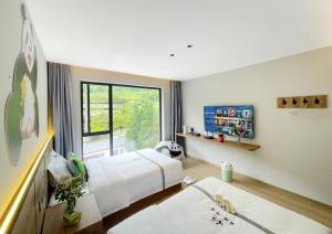 Letto o letti in una camera di Wolong Tongfu Tingtao B&B, China Great Beauty Bear Store