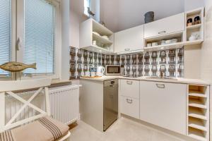 Kuhinja oz. manjša kuhinja v nastanitvi Lion Apartments - Deluxe Rooms 150 m from the sea & Sopot Center