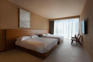 Postel nebo postele na pokoji v ubytování Roy Hotel-Tianya Town Store