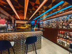 a bar with two stools in front of it at DAY & NIGHT by THE MOMENT in Chiang Mai