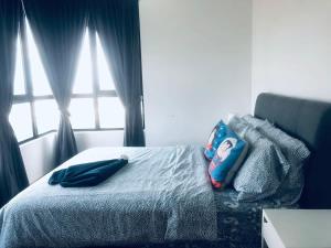 Ένα ή περισσότερα κρεβάτια σε δωμάτιο στο Ardent Homes at i-City - WiFi TV Box 1 Carpark