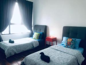 Ένα ή περισσότερα κρεβάτια σε δωμάτιο στο Ardent Homes at i-City - WiFi TV Box 1 Carpark
