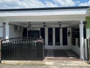 a white covered porch with a white roof at Ema Homestay in Temerloh