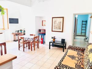 a living room with a couch and a table at Le antiche mura in Civitavecchia
