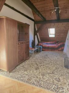 a living room with a couch and a cabinet at Haus Marienblick in Beeskow