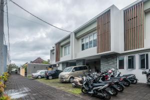 a row of motorcycles parked in front of a building at Mi Casa Residence in Seminyak