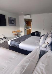 Voodi või voodid majutusasutuse Lake Dunstan Motel toas