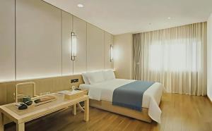 Ένα ή περισσότερα κρεβάτια σε δωμάτιο στο Hidden Abode Hotel, Chengdu Chunxi Road Tianfu Square Branch