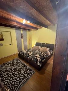 a bedroom with a bed and a rug at Centrum Wypoczynkowe Karman in Świbno +87 photos