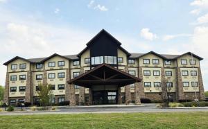 a large building with a black roof at Comfort Inn & Suites Near Lake Guntersville in Scottsboro