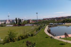 a view of a park with a pond at AdrianApartments ViVa in Cluj-Napoca +9 photos