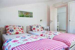 Postel nebo postele na pokoji v ubytování Apartments Tena
