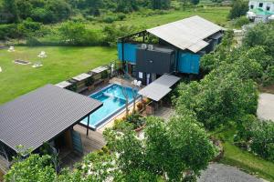 an aerial view of a house with a swimming pool at dChamp Retreat in Changlun