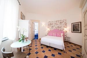 Postel nebo postele na pokoji v ubytování B&B Maiurè