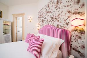 Postel nebo postele na pokoji v ubytování B&B Maiurè