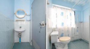 a blue bathroom with a toilet and a sink at OYO 1152 Hongpak Mint in Ban Bang Saen (1) +64 photos