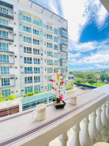 a balcony with a view of a building at 42 Chic City Escape for Three in Iloilo City