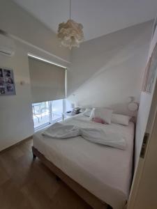 Postel nebo postele na pokoji v ubytování folitsa happy central home