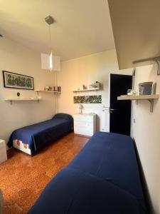 En eller flere senge i et værelse på La casa di Giò