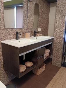 a bathroom with a sink and a mirror at Casa da Beira Rio in Marco de Canaveses +23 photos