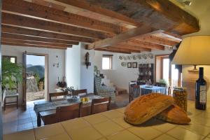 a living room with a large loaf of bread on the floor at Sa Cova Banyalbufar in Banyalbufar