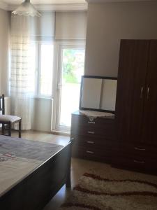 A bed or beds in a room at Safa Apartment