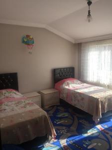 A bed or beds in a room at Safa Apartment