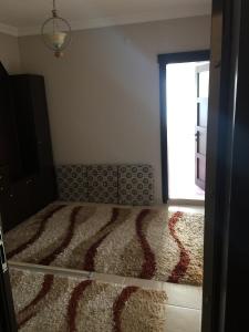 A bed or beds in a room at Safa Apartment