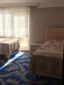 A bed or beds in a room at Safa Apartment