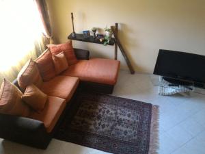 a living room filled with furniture and a couch at Sweet Sardinia Apartment in Elmas