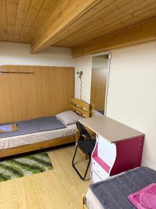 Voodi või voodid majutusasutuse Guesthouse Rest toas