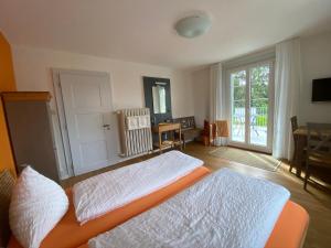 Postel nebo postele na pokoji v ubytování BnB Hopfengrün Langenthal