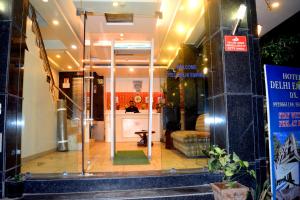 a store front of a store with a glass door at Hotel Delhi Empire Dx in New Delhi