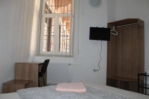 Posteľ alebo postele v izbe v ubytovaní Capital Guesthouse Budapest