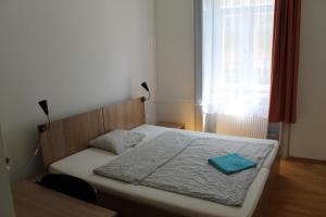 Posteľ alebo postele v izbe v ubytovaní Capital Guesthouse Budapest