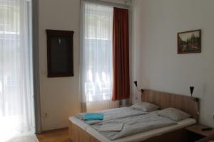 Posteľ alebo postele v izbe v ubytovaní Capital Guesthouse Budapest