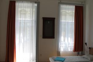 Posteľ alebo postele v izbe v ubytovaní Capital Guesthouse Budapest