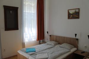 Posteľ alebo postele v izbe v ubytovaní Capital Guesthouse Budapest