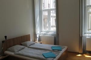 Posteľ alebo postele v izbe v ubytovaní Capital Guesthouse Budapest