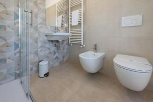 a bathroom with a toilet and a sink and a shower at Il Risveglio del Cavaliere Casa Vacanza in Gioia dei Marsi +61 photos